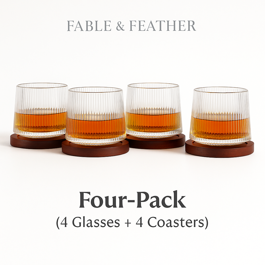 Four spinning whiskey glasses lined up with coasters