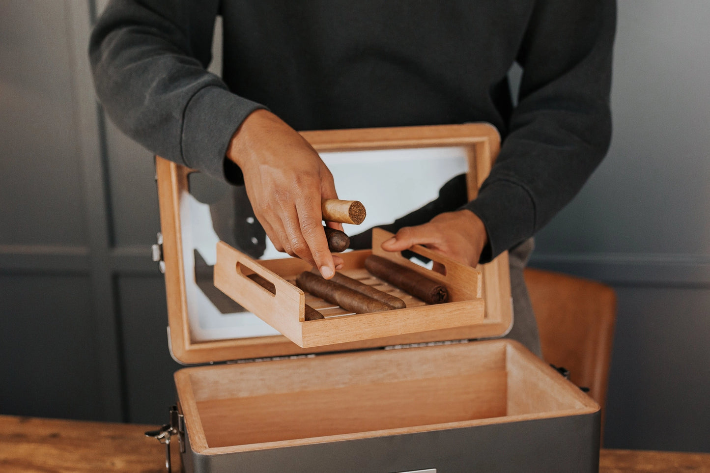 Luxury Military Humidor Cabinet featuring black ash, gold accents, PEG-organized drawers, and Hydro Tray humidity control.
