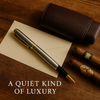 Luxury champagne finish rollerball pen with polished gold accents, perfect executive gift and premium writing accessory
