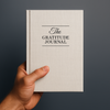 Gratitude Journal hardcover held in hand