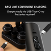 Electric wine opener charging on USB-C base with storage compartment.