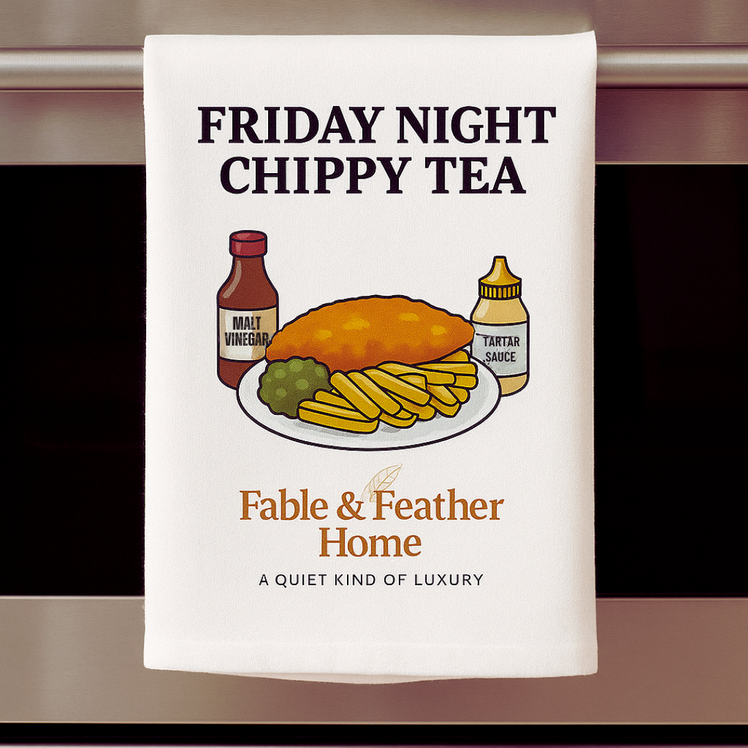 Friday Night Chippy Tea – British Banter tea towel draped over oven door with fish and chips design.