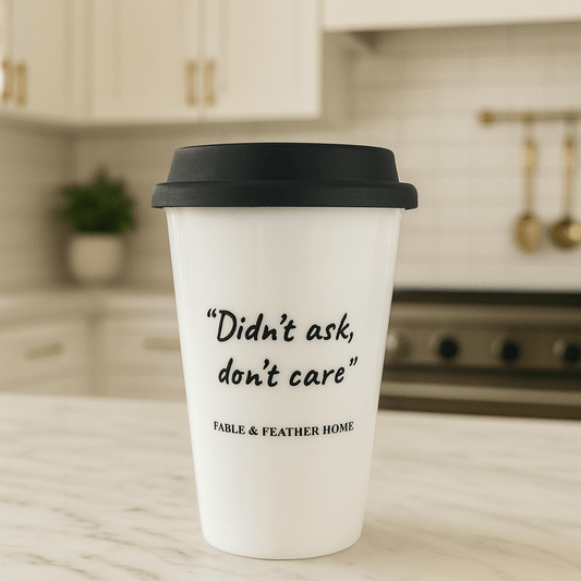 Didn’t Ask, Don’t Care ceramic mug placed on a marble kitchen countertop with a bright, clean background.