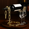 Floating chain wine bottle holder in gold finish – luxury bar decor