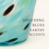 Close-up of hand-blown turquoise marbled glass vase showing wobbled texture and earthy details.