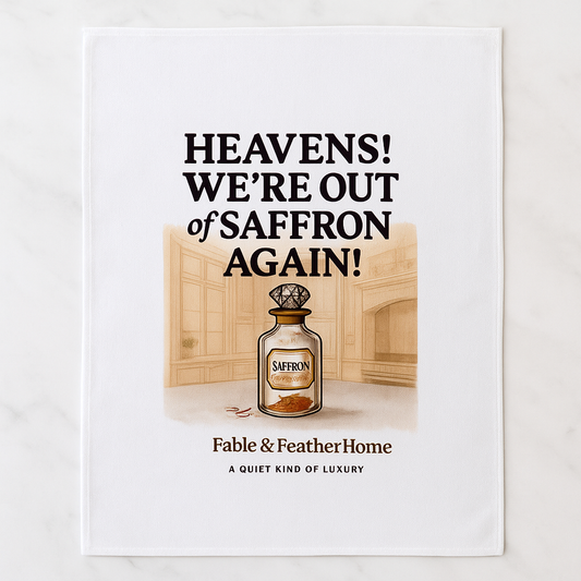 Heavens We're Out Of Saffron Again Tea Towel On a Marble Surface
