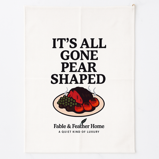 It's All Gone Pear Shaped Funny Tea Towel Layed Out On A Kitchen Counter