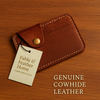 Tan full-grain Crazy Horse leather card sleeve on wooden surface