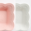 Elegant Belle Époque ceramic dessert bowl set with plate and spoon, pink-white embossed design for luxury dining