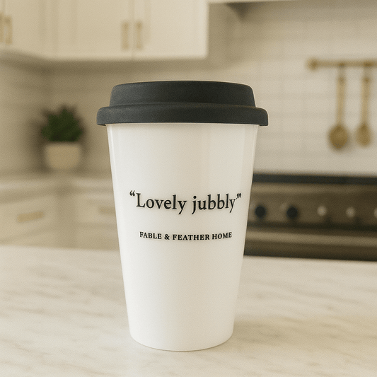 Lovely Jubbly ceramic travel mug featuring cheeky British slang, perfect for witty coffee lovers and tea enthusiasts