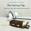 Brown leather golf accessory with brass hardware