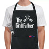 Funny black apron reading ‘The Grillfather’ with grilling utensils design.