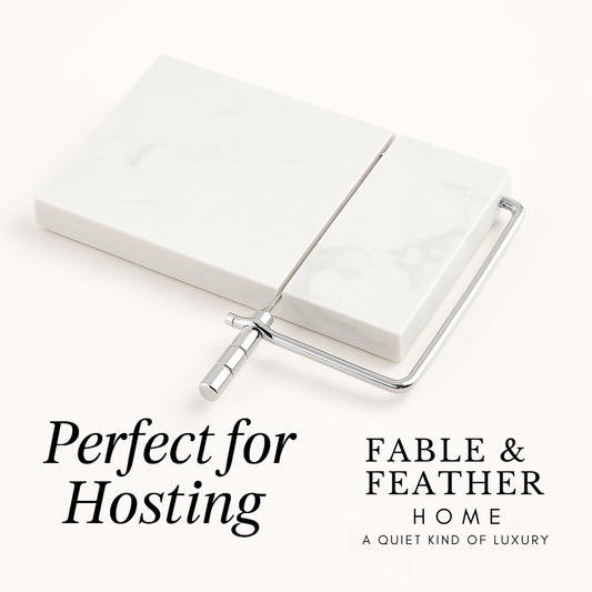 Marble cheese slicer on white background with Perfect for Hosting text and Fable & Feather Home logo.