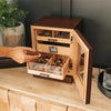 Luca Humidor Cabinet in brown walnut with three drawers, felt-lined accessory tray, and Hydro Tray humidity system