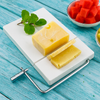 Luxury marble cheese board with stainless steel cutter, perfect for charcuterie and elegant kitchenware gifts