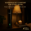 Veloura WhisperQuiet cold-air diffuser releasing soft mist on a bedroom nightstand by Fable & Feather Home