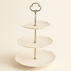 Round embossed tiered cake stand with pastries and tea set