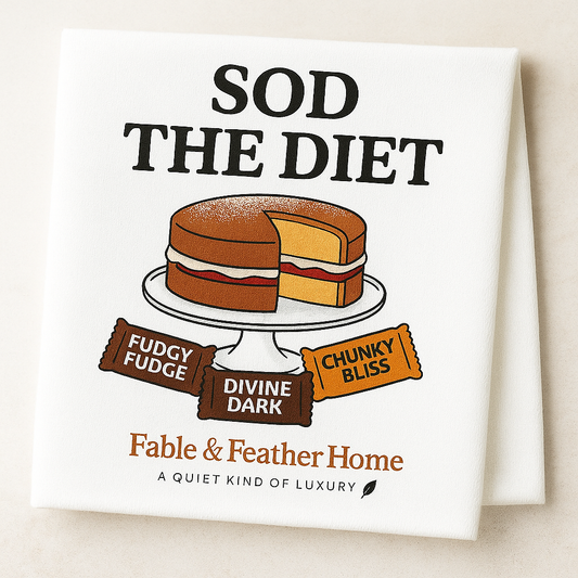 Funny British tea towel with bold text ‘Sod the Diet’ and illustration of a Victoria sponge cake with chocolate bar wrappers. Designed by Fable & Feather Home.